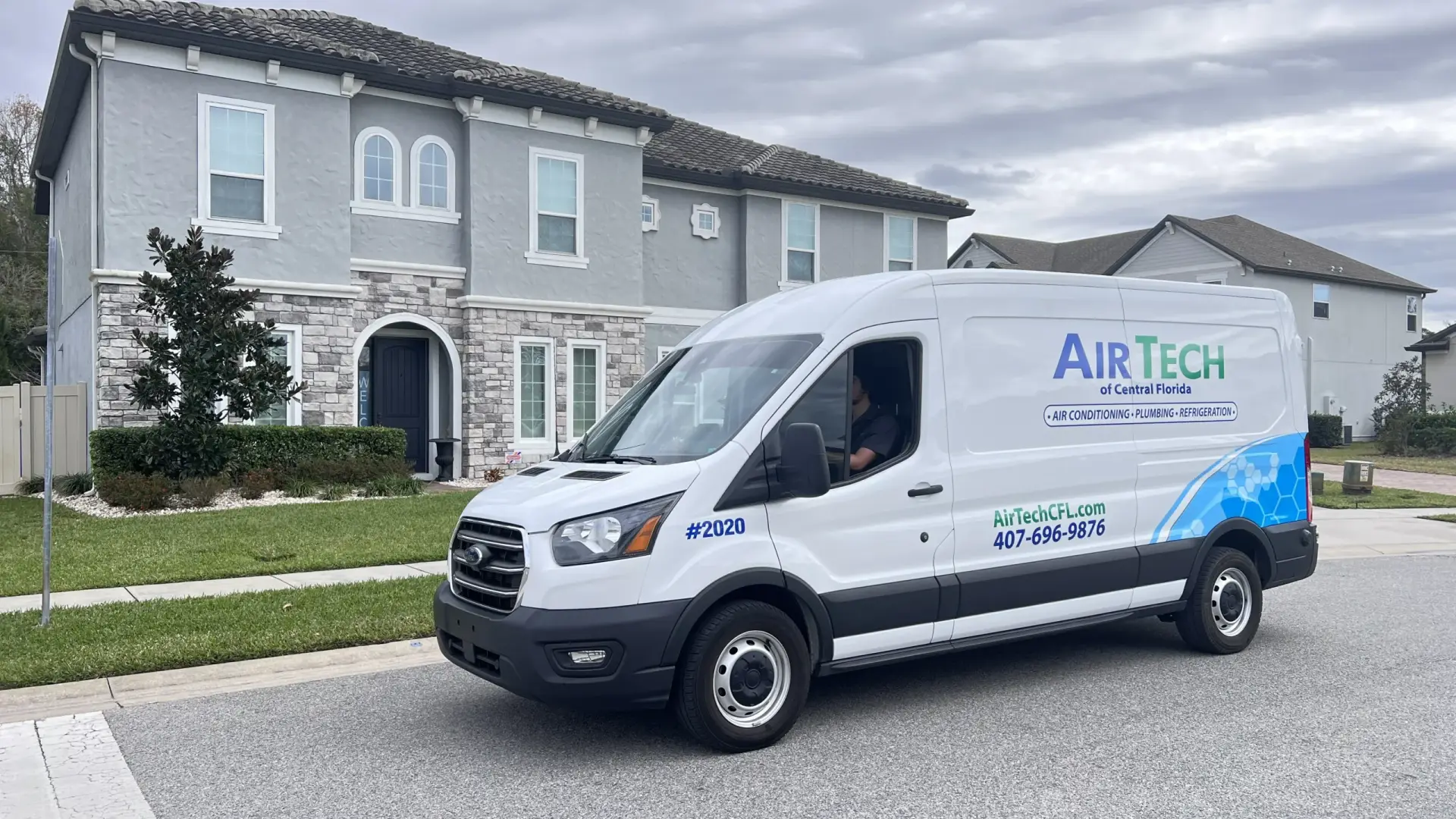 HVAC technician installing an air conditioning unit in a Central Florida home, highlighting professional service